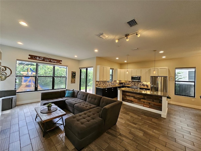 3238 W 96th Pl, Hialeah, FL 33018 - living room with recessed lighting, healthy amount of natural light, and wood finish floors