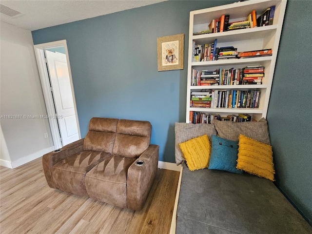 3238 W 96th Pl, Hialeah, FL 33018 - sitting room with baseboards and wood finished floors