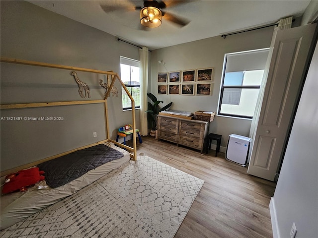 3238 W 96th Pl, Hialeah, FL 33018 - bedroom featuring light wood-style flooring and ceiling fan