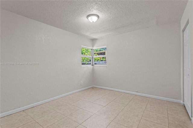 5288 N Andrews Ave, Oakland Park, FL 33309 - unfurnished room featuring a textured ceiling and light tile patterned flooring