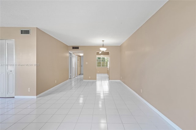 8305 NW 61st St Unit C305, Tamarac, FL 33321 - empty room with light tile patterned floors and baseboards