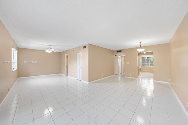 8305 NW 61st St Unit C305, Tamarac, FL 33321 - spare room with a ceiling fan, healthy amount of natural light, and light tile patterned floors
