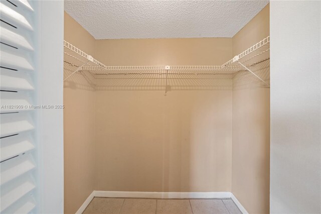 8305 NW 61st St Unit C305, Tamarac, FL 33321 - walk in closet featuring tile patterned flooring