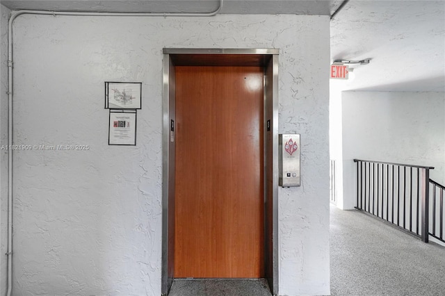 8305 NW 61st St Unit C305, Tamarac, FL 33321 - hall with elevator and a textured wall