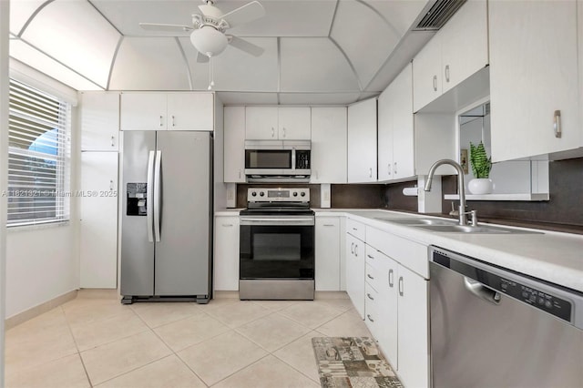 2504 Antigua Ter Unit L4, Coconut Creek, FL 33066 - kitchen with stainless steel appliances, backsplash, ceiling fan, light countertops, and light tile patterned floors