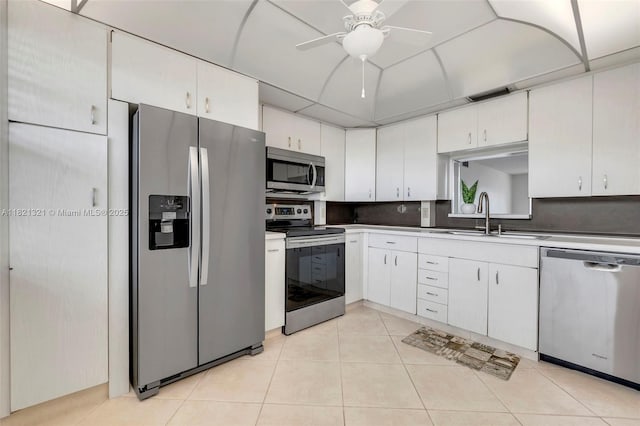 2504 Antigua Ter Unit L4, Coconut Creek, FL 33066 - kitchen with stainless steel appliances, ceiling fan, light tile patterned floors, and white cabinetry