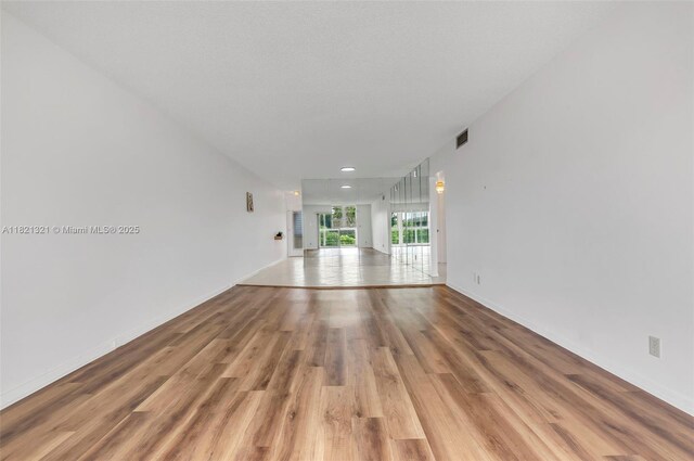 2504 Antigua Ter Unit L4, Coconut Creek, FL 33066 - unfurnished living room with light wood-style floors and recessed lighting