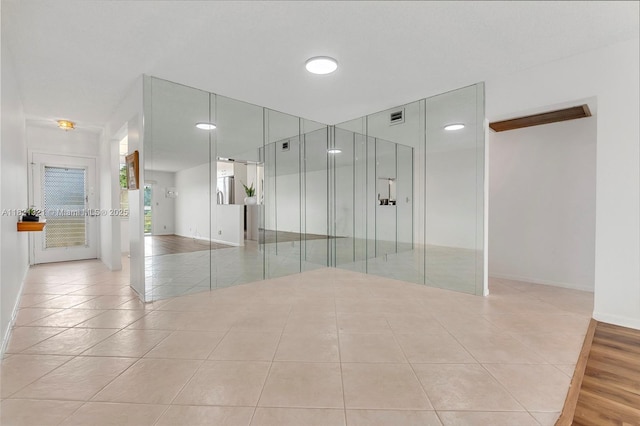 2504 Antigua Ter Unit L4, Coconut Creek, FL 33066 - spare room with light tile patterned flooring and baseboards