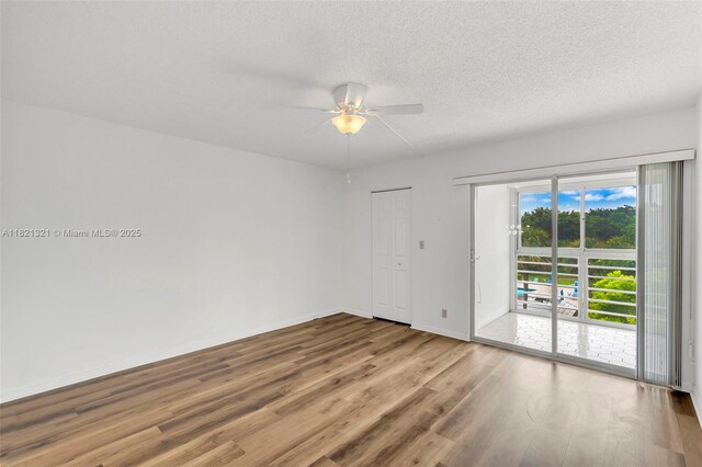 2504 Antigua Ter Unit L4, Coconut Creek, FL 33066 - unfurnished room with wood finished floors, ceiling fan, and a textured ceiling