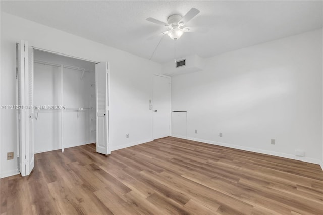 2504 Antigua Ter Unit L4, Coconut Creek, FL 33066 - unfurnished bedroom with wood finished floors, ceiling fan, and a closet