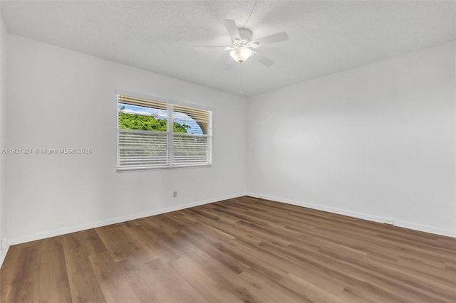 2504 Antigua Ter Unit L4, Coconut Creek, FL 33066 - unfurnished room with wood finished floors, ceiling fan, and a textured ceiling