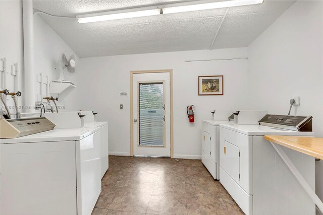 2504 Antigua Ter Unit L4, Coconut Creek, FL 33066 - community laundry featuring washer and dryer and a textured ceiling