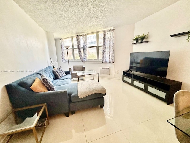 1936 S Ocean Dr Unit 7C, Hallandale Beach, FL 33009 - living area with a textured ceiling, tile patterned flooring, and a wall unit AC