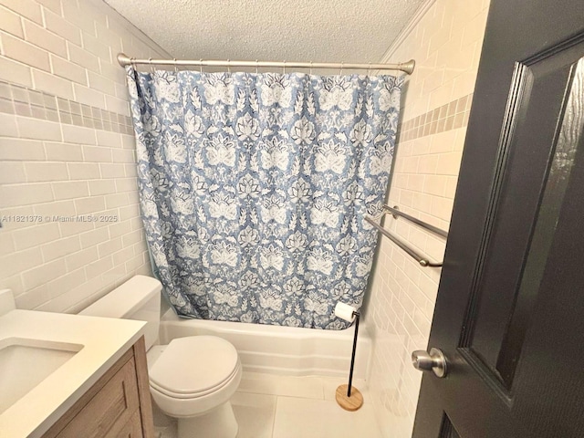 1936 S Ocean Dr Unit 7C, Hallandale Beach, FL 33009 - full bath with tile walls, a textured ceiling, shower / bathtub combination with curtain, vanity, and tile patterned floors