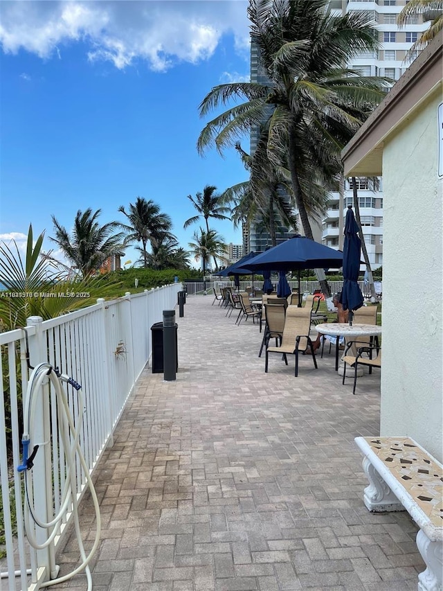 1936 S Ocean Dr Unit 7C, Hallandale Beach, FL 33009 - surrounding community with a patio area and outdoor dining area