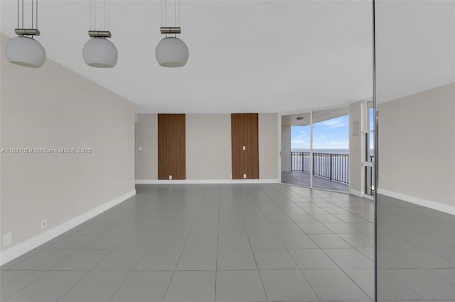 1901 Brickell Ave Unit B1508, Miami, FL 33129 - spare room with expansive windows and light tile patterned flooring