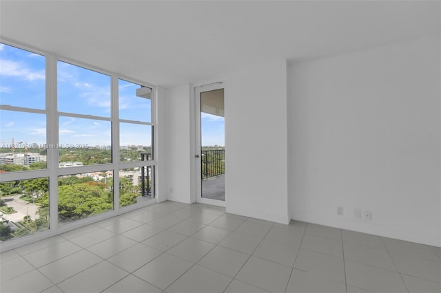 1901 Brickell Ave Unit B1508, Miami, FL 33129 - unfurnished room featuring a wall of windows, a view of city, and tile patterned floors