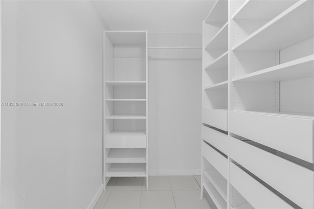 1901 Brickell Ave Unit B1508, Miami, FL 33129 - spacious closet featuring light tile patterned flooring