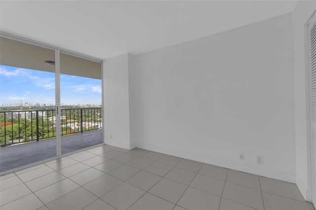 1901 Brickell Ave Unit B1508, Miami, FL 33129 - empty room featuring expansive windows and tile patterned flooring