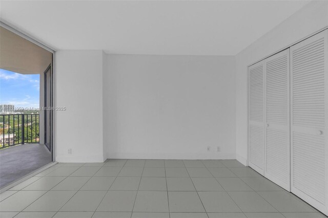 1901 Brickell Ave Unit B1508, Miami, FL 33129 - unfurnished bedroom featuring expansive windows, access to outside, and a closet