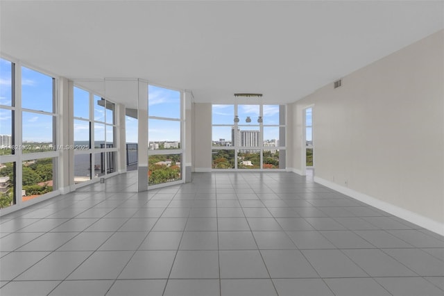 1901 Brickell Ave Unit B1508, Miami, FL 33129 - unfurnished sunroom with a wall of windows, a view of city, and tile patterned flooring