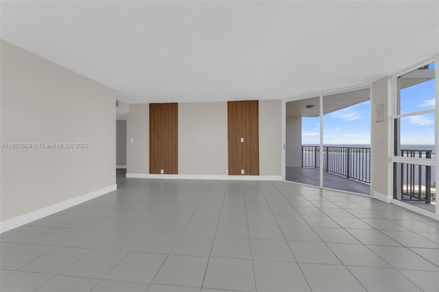 1901 Brickell Ave Unit B1508, Miami, FL 33129 - unfurnished room with a wall of windows and baseboards