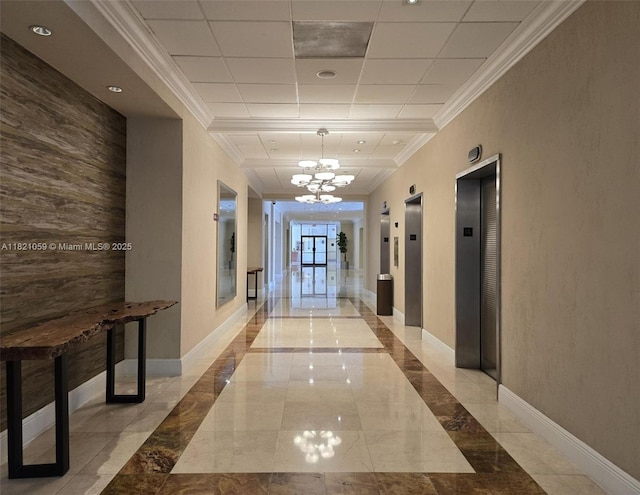 1901 Brickell Ave Unit B1508, Miami, FL 33129 - hallway featuring elevator, a chandelier, crown molding, inlaid floor details, and marble tiled flooring