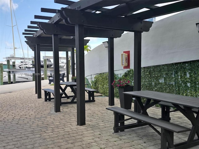 1901 Brickell Ave Unit B1508, Miami, FL 33129 - view of patio with a pergola and a water view
