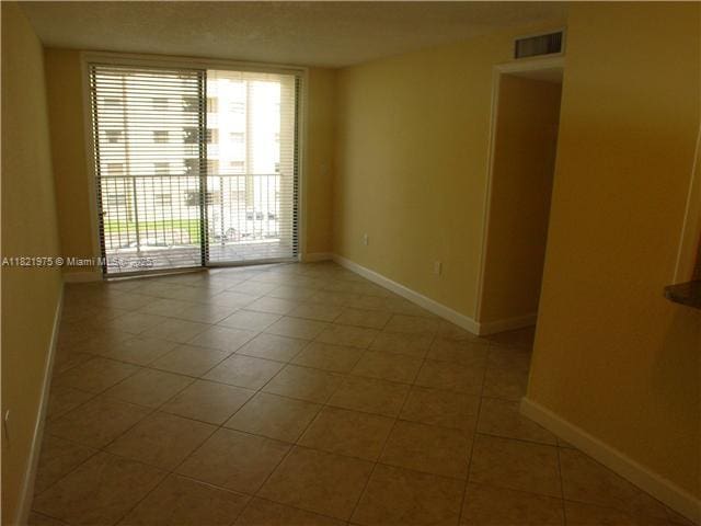 8185 NW 7th St Unit 316, Miami, FL 33126 - unfurnished room with tile patterned floors