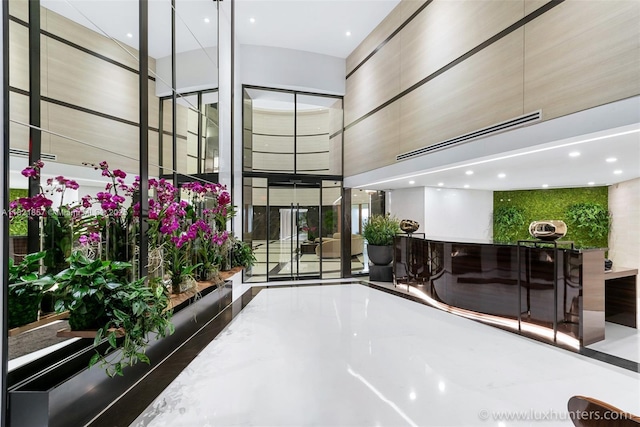 300 S Pointe Dr Unit 1602, Miami Beach, FL 33139 - lobby featuring a high ceiling and recessed lighting