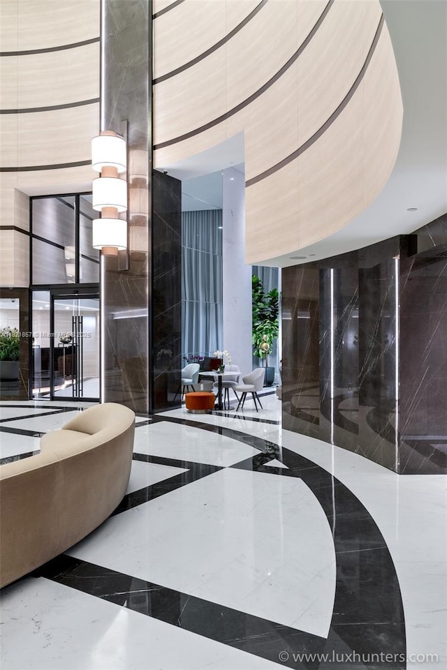300 S Pointe Dr Unit 1602, Miami Beach, FL 33139 - common area with a high ceiling