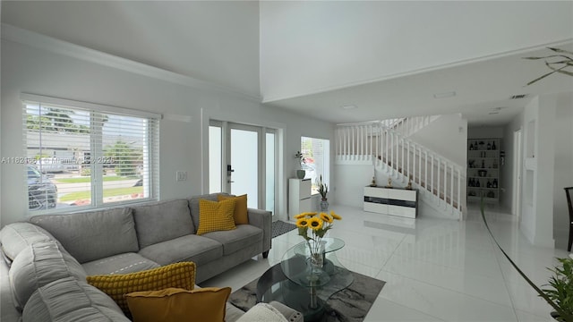 12923 SW 207th Ter, Miami, FL 33177 - living area featuring light tile patterned floors, stairway, and high vaulted ceiling