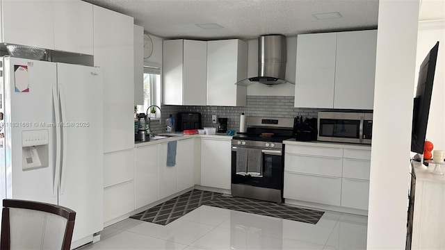 12923 SW 207th Ter, Miami, FL 33177 - kitchen with appliances with stainless steel finishes, wall chimney range hood, tasteful backsplash, white cabinets, and a textured ceiling