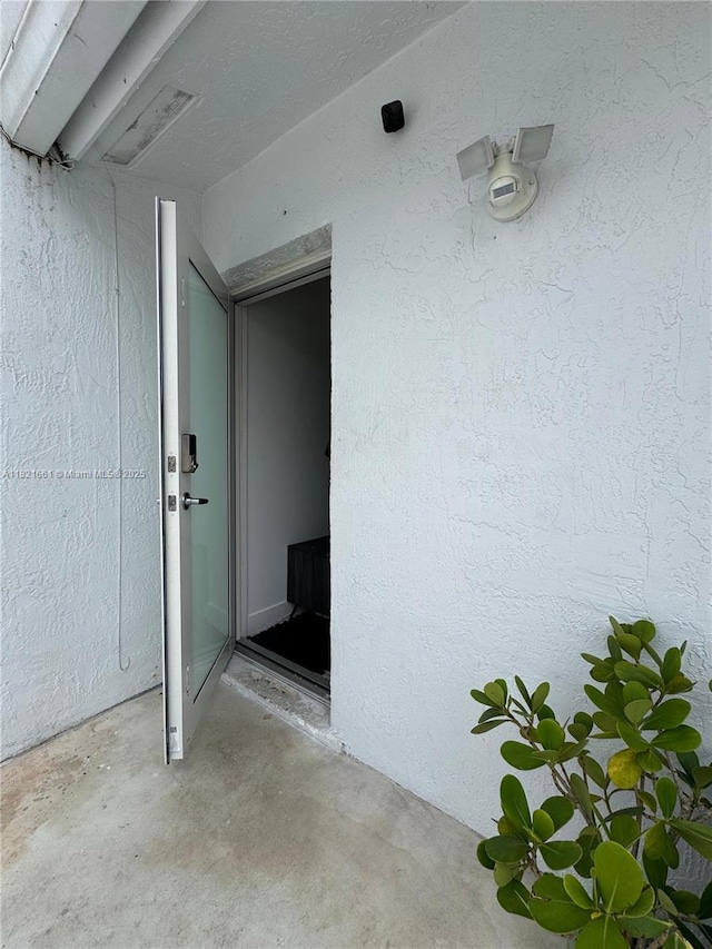 12923 SW 207th Ter, Miami, FL 33177 - view of exterior entry featuring stucco siding