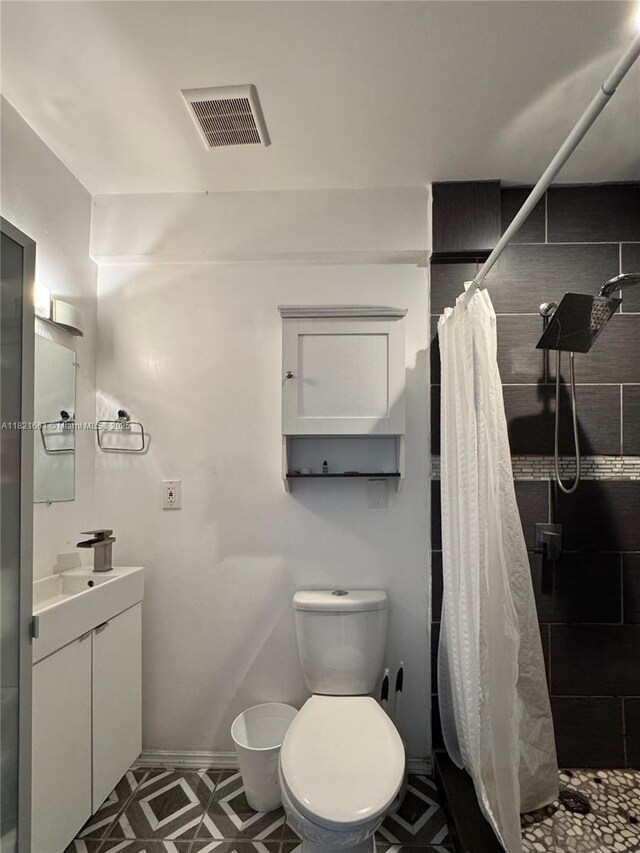 12923 SW 207th Ter, Miami, FL 33177 - full bathroom with vanity, a stall shower, and tile patterned floors