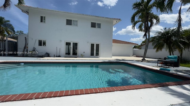 12923 SW 207th Ter, Miami, FL 33177 - view of swimming pool with french doors and a patio