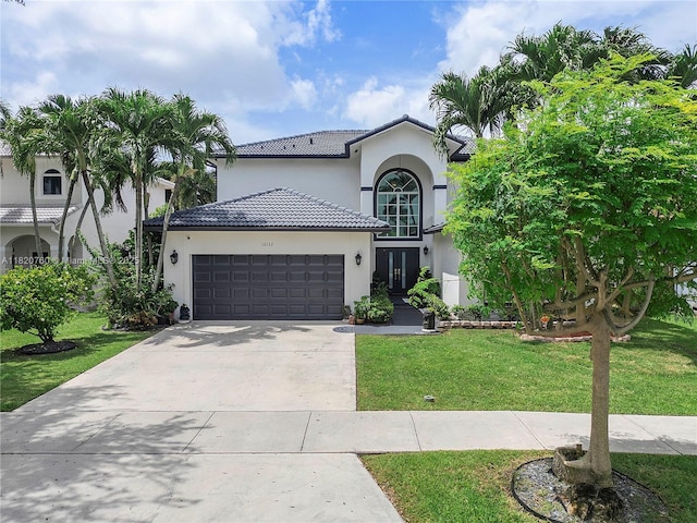 16132 SW 147th Ln, Miami, FL 33196 - mediterranean / spanish home with a front yard, stucco siding, an attached garage, a tile roof, and concrete driveway
