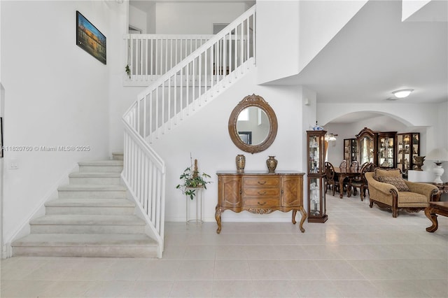 16132 SW 147th Ln, Miami, FL 33196 - stairs featuring tile patterned flooring and arched walkways