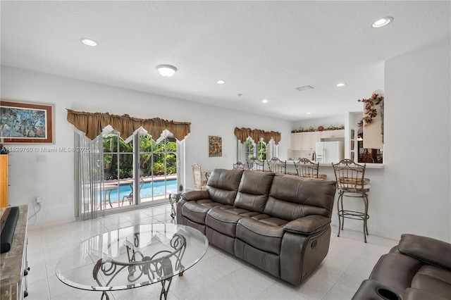 16132 SW 147th Ln, Miami, FL 33196 - living area featuring recessed lighting, a textured ceiling, and light tile patterned floors