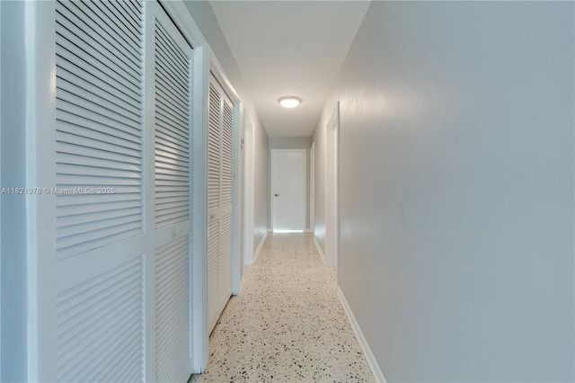 3731 SW 88th Pl, Miami, FL 33165 - corridor featuring baseboards and dark speckled floor