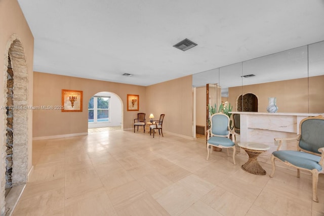 5025 SW 90th Ct, Miami, FL 33165 - sitting room with arched walkways and tile patterned floors