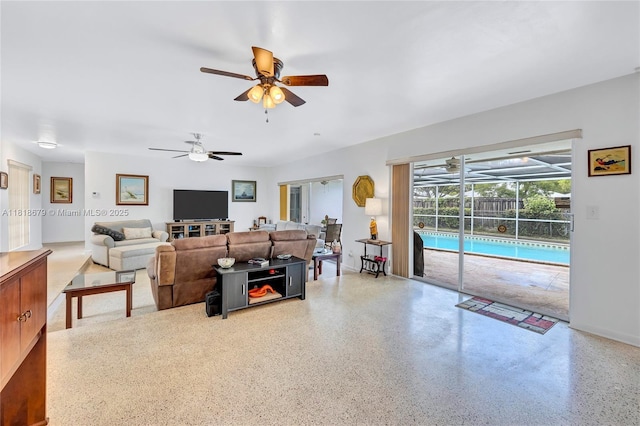 6736 Orchid Dr, Miami Lakes, FL 33014 - living area with a ceiling fan, a sunroom, and speckle patterned floor