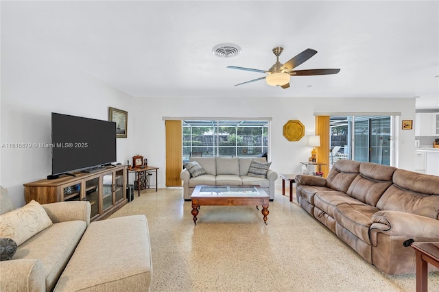 6736 Orchid Dr, Miami Lakes, FL 33014 - living area featuring dark aggregate flooring and ceiling fan