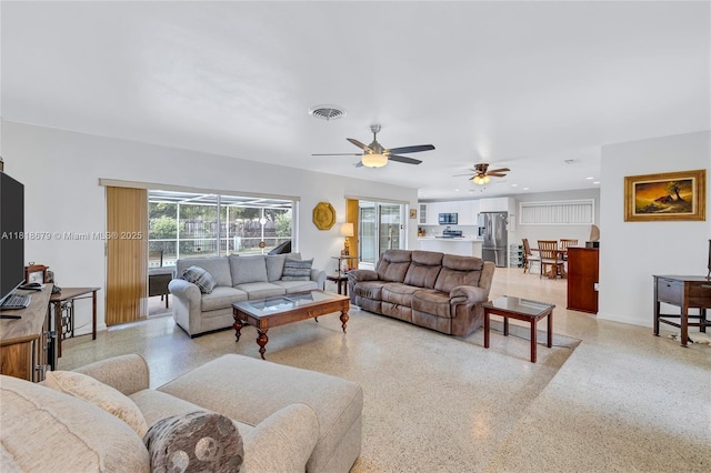 6736 Orchid Dr, Miami Lakes, FL 33014 - living room with dark speckled floor, a ceiling fan, and recessed lighting