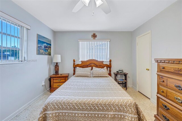 6736 Orchid Dr, Miami Lakes, FL 33014 - bedroom with dark speckled floor and a ceiling fan
