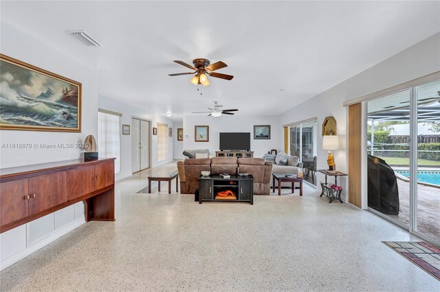 6736 Orchid Dr, Miami Lakes, FL 33014 - living area featuring speckle patterned floor and a ceiling fan