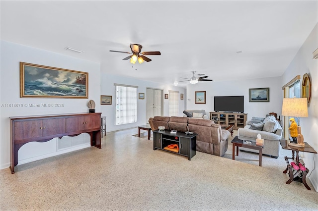 6736 Orchid Dr, Miami Lakes, FL 33014 - living room featuring a ceiling fan and baseboards