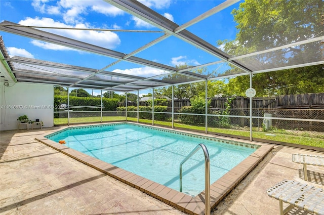 6736 Orchid Dr, Miami Lakes, FL 33014 - view of swimming pool featuring a fenced backyard, a patio area, and glass enclosure