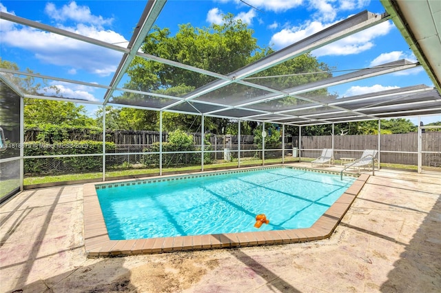 6736 Orchid Dr, Miami Lakes, FL 33014 - view of pool with a fenced backyard, a patio, and glass enclosure