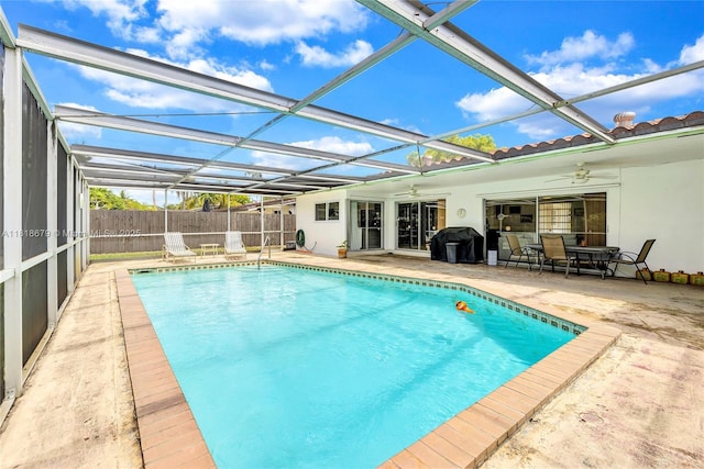 6736 Orchid Dr, Miami Lakes, FL 33014 - view of pool featuring ceiling fan, a patio, and glass enclosure